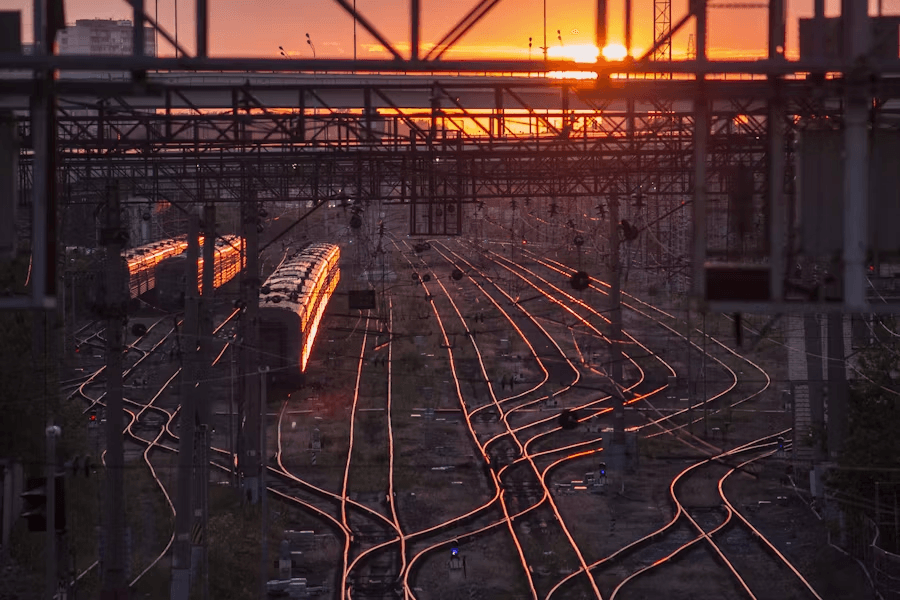 Railway tracks and yard at sunset